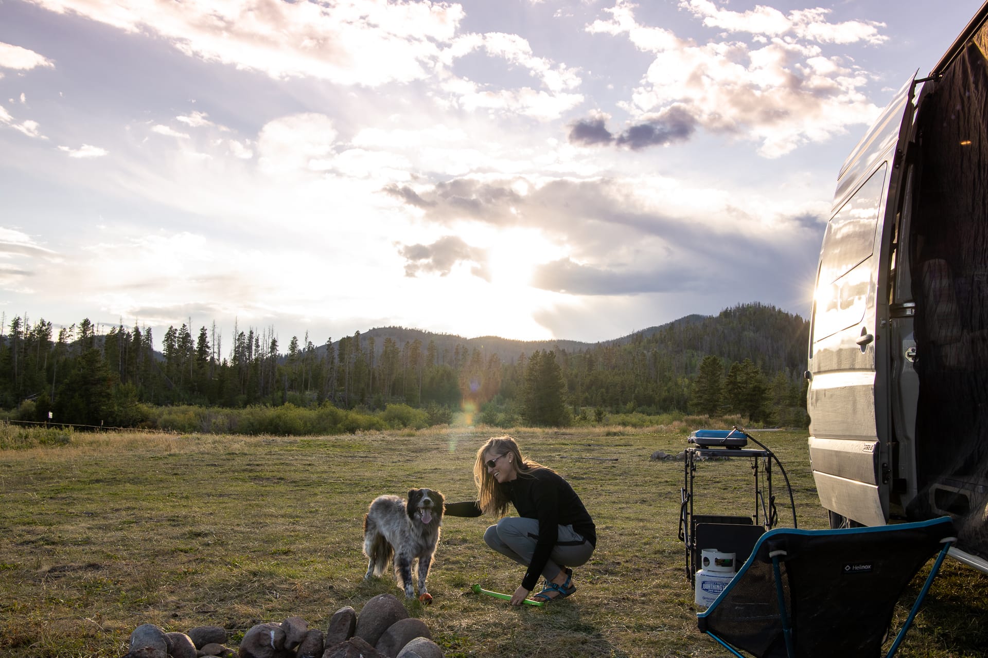 Kristen Bor and dog at a free dispersed campsite at sunset
